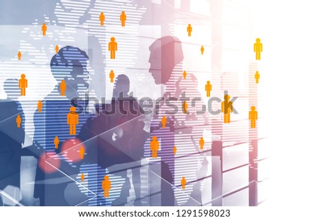Silhouettes of business people interacting over skyscraper background with double exposure of global people network hologram. Toned image Elements of this image furnished by NASA