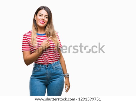 Young beautiful woman casual look over isolated background cheerful with a smile of face pointing with hand and finger up to the side with happy and natural expression on face looking at the camera.
