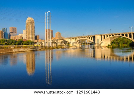 City landscape reflection in Mississippi River. Bridge