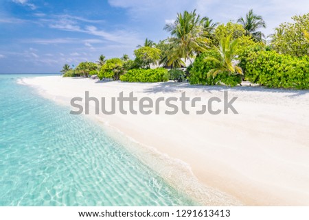 Amazing panorama at Maldives. Luxury resort beach, seascape with soft white sand under blue sky. Wonderful relaxing scenery. Beautiful beach background for vacation holiday banner concept