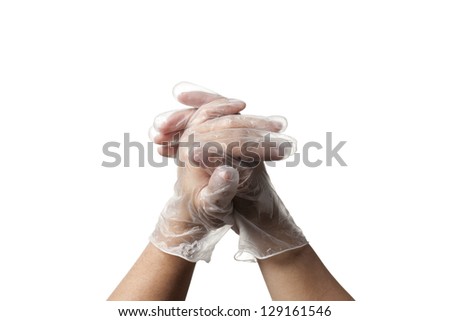 Close-up shot of human hand in transparent glove.