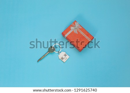 Buying an apartment. mortgage, housing as a gift, housing for a young family. Key, gift box