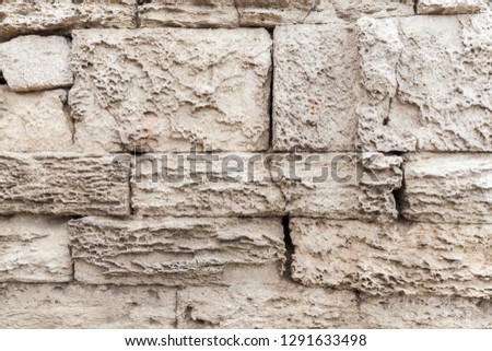 Old grungy stone wall, close-up flat background photo texture