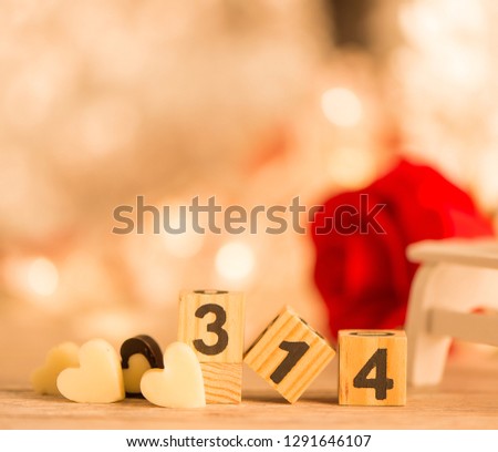 Concept of Valentine, anniversary, wedding celebration and propose, heart shapes on a white wooden bench, bokeh background, closeup