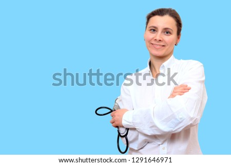 Portrait of doctor therapist with stethoscope on blue background