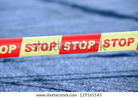 Red and yellow STOP security tape
