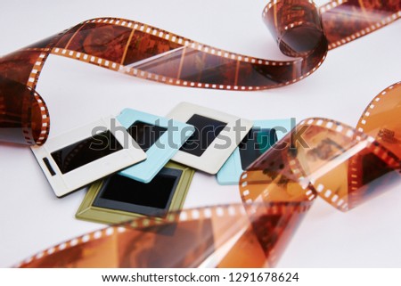 film and slides on a white background, in a beautiful composition