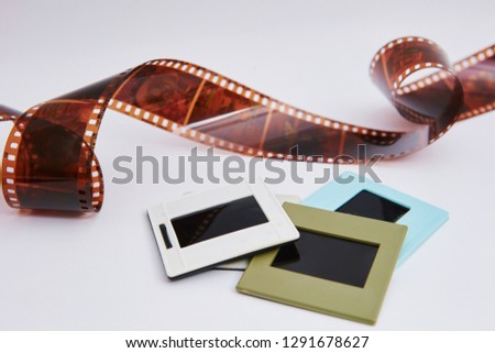 film and slides on a white background, in a beautiful composition