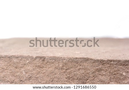 Stone board empty table in front, Perspective brown rock over blur white background.