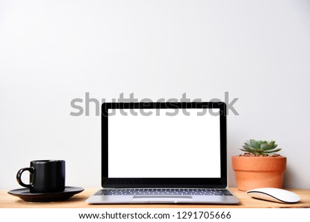 Working with Laptop computer,Hot coffee and plant copy space on desk background,business Concept