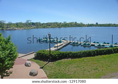              A picture of a smooth lake front in the summer