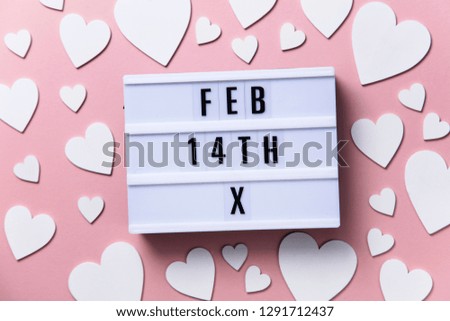 Feb 14th lightbox message with white hearts on a pink background