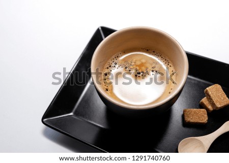 Black cup with black coffee and sugar on white background - Image