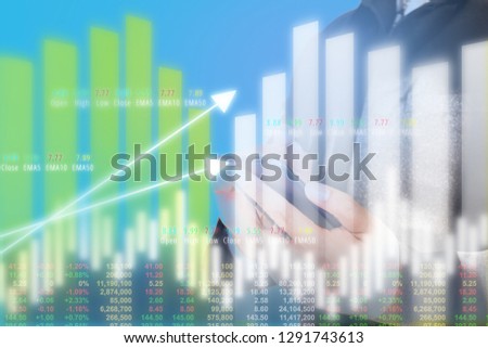 Businessman on digital stock market financial positive indicator background. Double exposure of growth graph futuristic economic currency chart investor data analysis money exchange technology concept