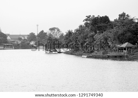Black and white picture of Evening view of the Mae Klong River Is the river that is used to travel From the past to the present. Vintage background.