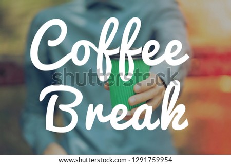 Paper cup of coffee outdoors , coffee break banner 