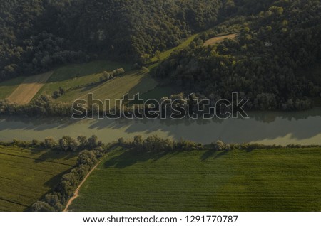 View of the Tiber River among the fields from a bird's-eye view