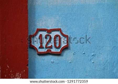 House number sign 120 on street in Havana Cuba
