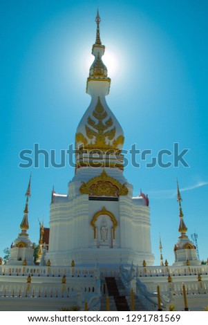 The pagoda contains the bones of the Buddha,Temple and blue sky,Wat Sorn Pracharam.Sakon Nakhon,Thailand.