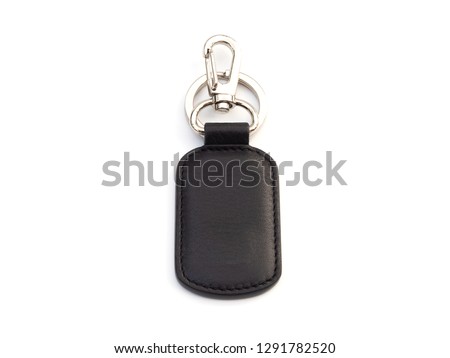 new leather keychain for car or home isolated on white background