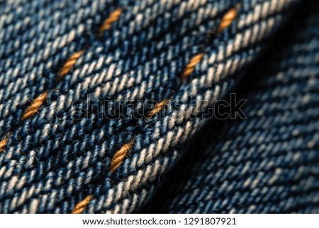 Blue jeans textile pattern background. Macro close-up photography.