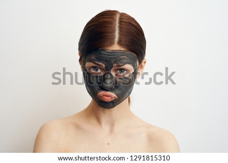sad woman in a cosmetic mask portrait
