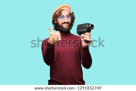 French artist with a beret and vintage movie camera