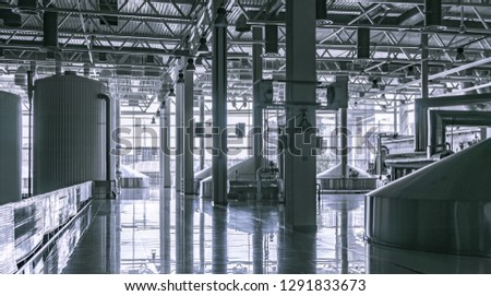 Modern interior of a brewery mash vats metal containers Royalty-Free Stock Photo #1291833673