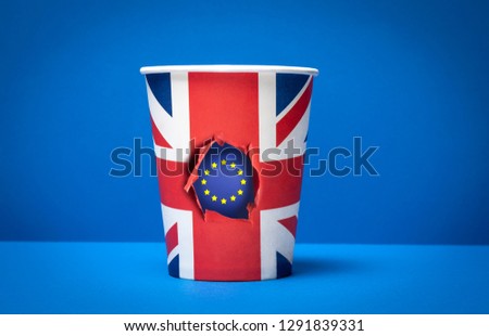 Brexit concept London. United Kingdom and European Union flags. flag on paper cup and blue backdrop with space for text. 