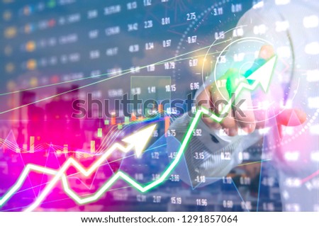 showing the Trading graph over the Abstract blurred photo, Business graph and trade monitor of Investment Futures market, app interface is to trade stocks, currencies. stock broker tool.