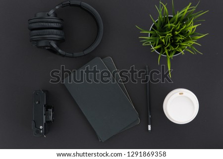 Minimal Creative Top View Work Space Flat Lay with Headphones, Retro Camera, Notebook and Coffee with Copy Space