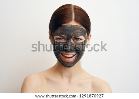 joyful woman smiling on face cosmetic face care mask