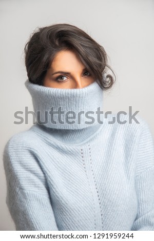 girl in the light blue turtle neck  Royalty-Free Stock Photo #1291959244