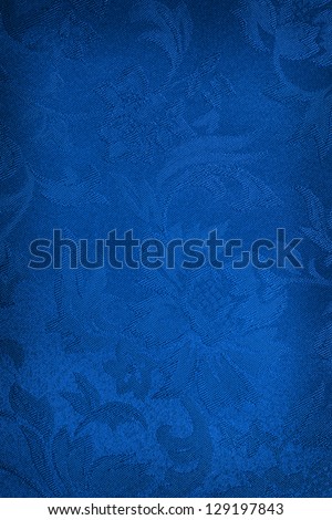 Embroidered blue silk or damask background.