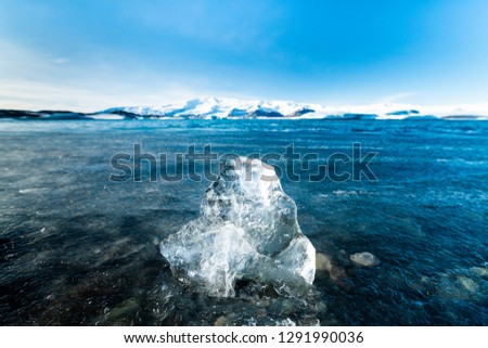 Close up of iceberg or glacier at  Jokulsarlon,the glacier lagoon in Iceland. It is Blue tone picture. The blue lagoon and blue iceberg in Daylight. it is symbol of Iceland