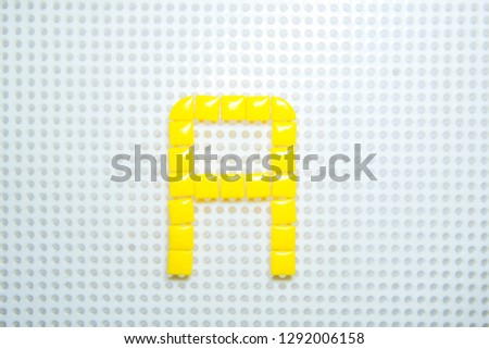letter A created with children toys similar to pixels