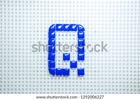 letter Q created with children toys similar to pixels