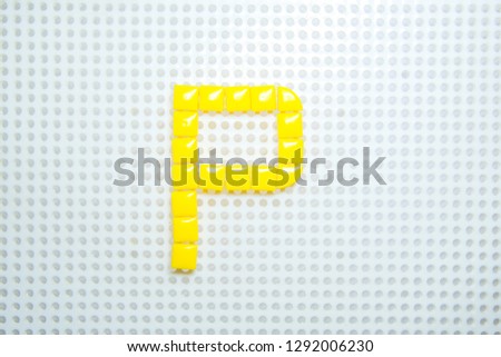 letter P created with children toys similar to pixels
