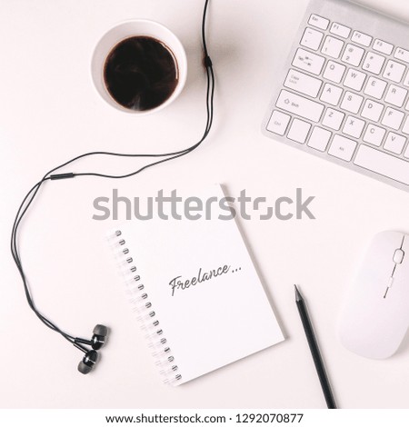 Keyboard and coffee on white background. The view from the top. The concept of home office or freelance