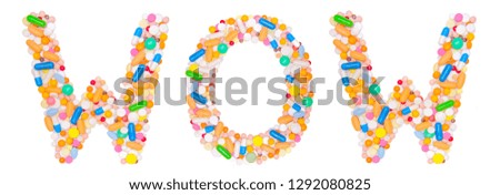 word wow is collected from medical tablets, pills, capsules, vitamin. Isolated on white background. Concept: ABC, design, logo, title, text