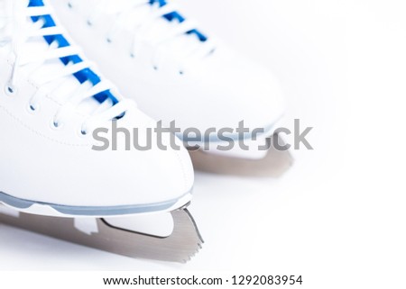 Close up view. New white figure skates on a white background.