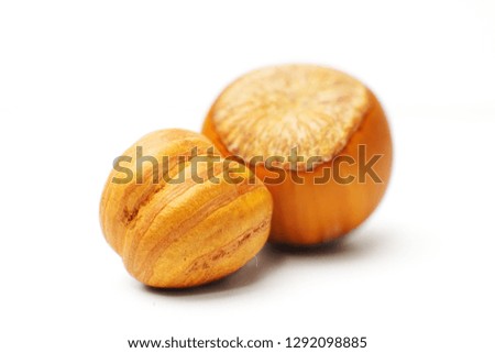 Hazelnuts in closeup isolated on a white background