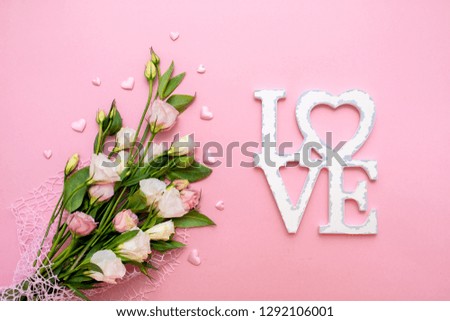 Festive bouquet of flowers for the beloved on a pink background. The concept of love congratulations on the wedding, March 8, Valentine's Day, Christmas and birthday. Copy space.