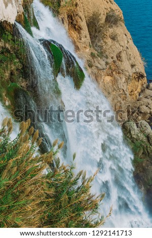 Vertical video shoot of beautiful Lower Duden waterfall in Antalya city, Turkey country, Mediterranean sea. Vertical color photography