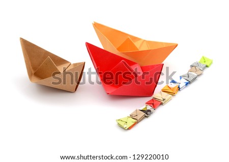 Color paper boats at race concept