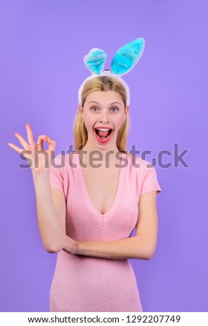 Happy easter! Girl shows sign okay. Easter. Bunny. Spring holidays. Easter Day. Smiling girl with bunny ears. Bunny ears. Sale. Discount. Sign ok. Ok. Okay.