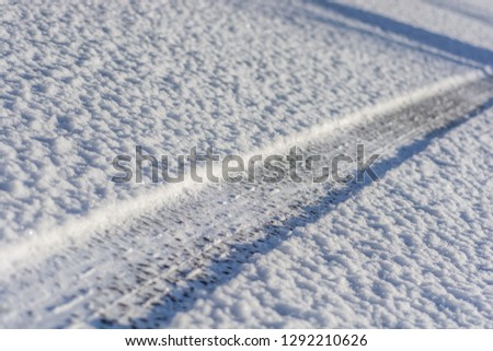 Tyre track in fresh snow
