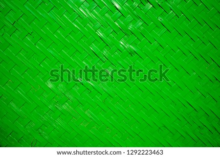 Green woven or weave straw texture background. Basket weave seamless pattern. Wicker repeating texture.