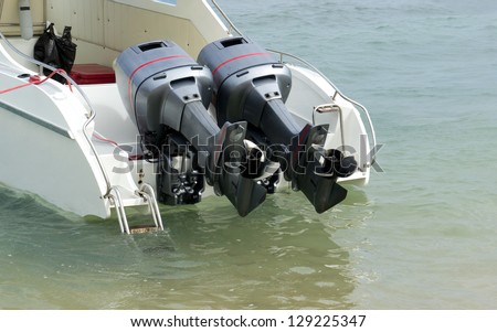 Two speed engines are lifted out of the water Royalty-Free Stock Photo #129225347