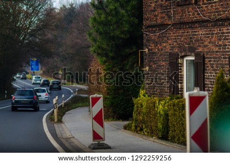 House with bricks wall and city road of Germany